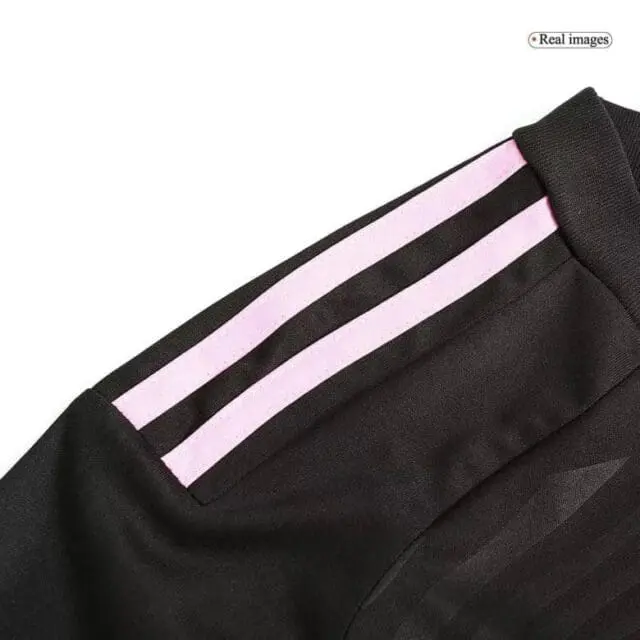 a close up of a black and pink sports uniform
