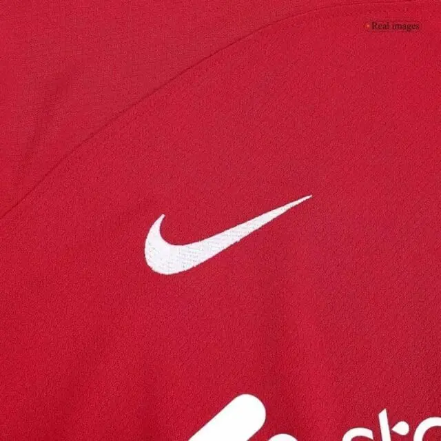 a red shirt with a white swoosh