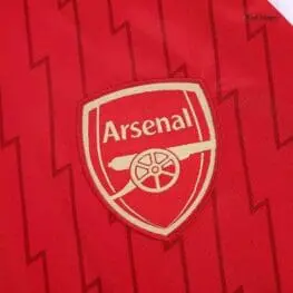a red and white sports jersey with a logo