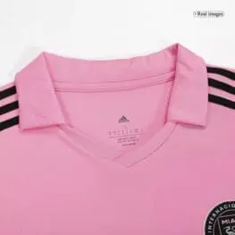 a pink shirt with black stripes