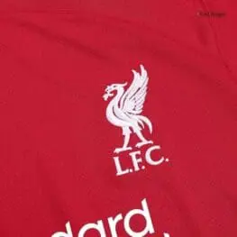 a red shirt with a white bird on it