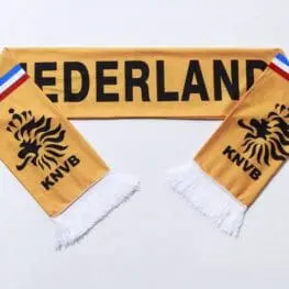 a yellow scarf with black text and a blue and red stripe