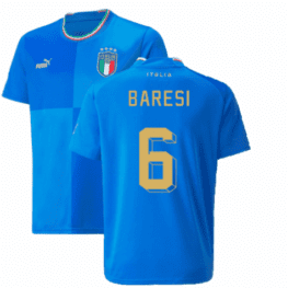 a blue jersey with yellow text and a green stripe
