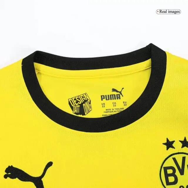 a yellow shirt with black trim