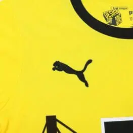 a yellow shirt with a logo
