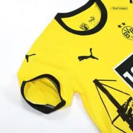 a yellow shirt with black and white graphics