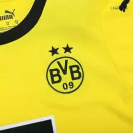 a yellow shirt with black text