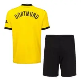 a yellow shirt and black shorts