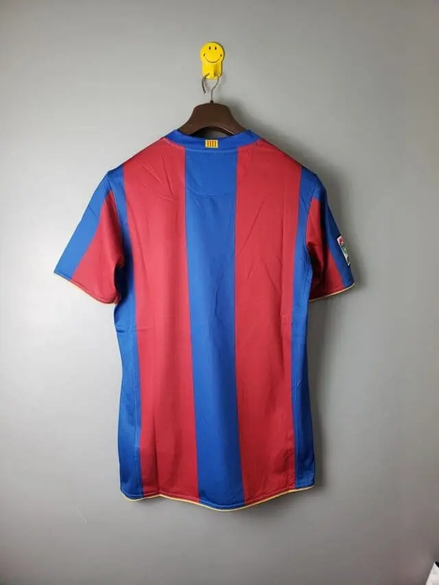 a red and blue striped shirt on a swinger