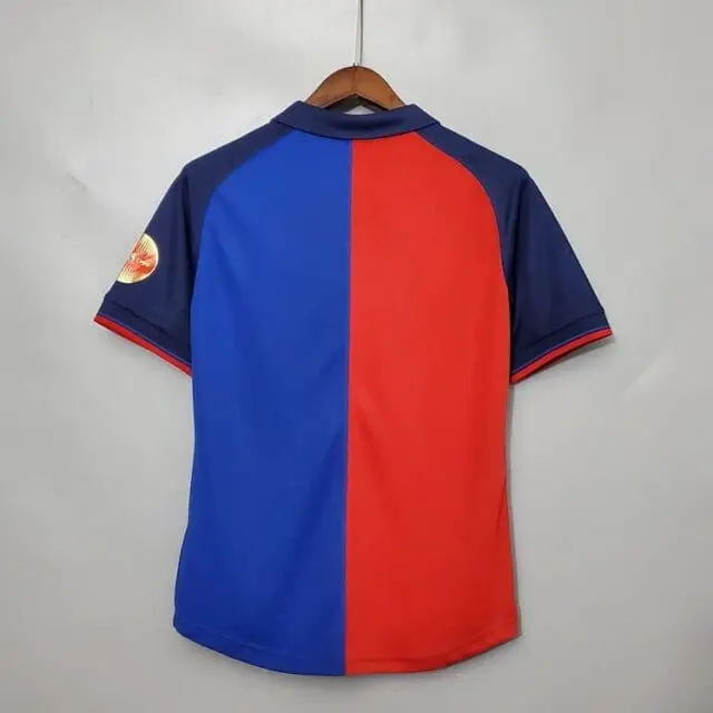 a red and blue shirt on a swinger