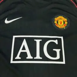 a black sports jersey with a logo on it