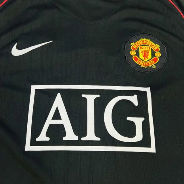 a black sports jersey with a logo on it