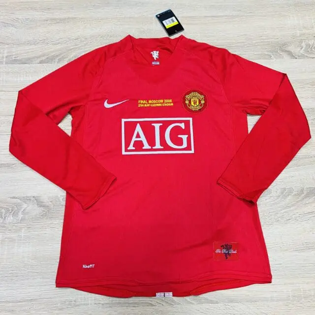 a red shirt on a wooden surface