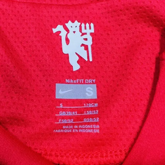 a red shirt with white text and a logo