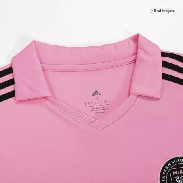 a pink shirt with black stripes
