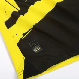 a close up of a black and yellow jersey