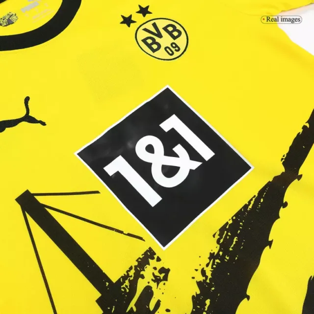 a yellow jersey with black and white text