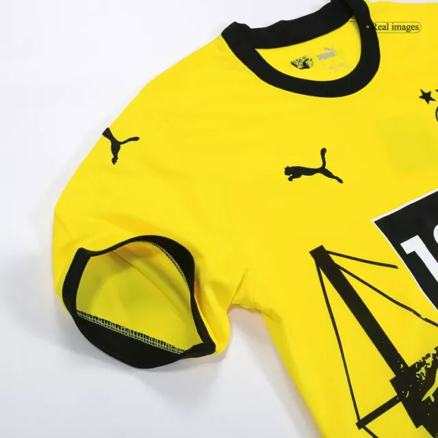 a yellow shirt with black designs