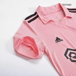 a pink shirt with black stripes