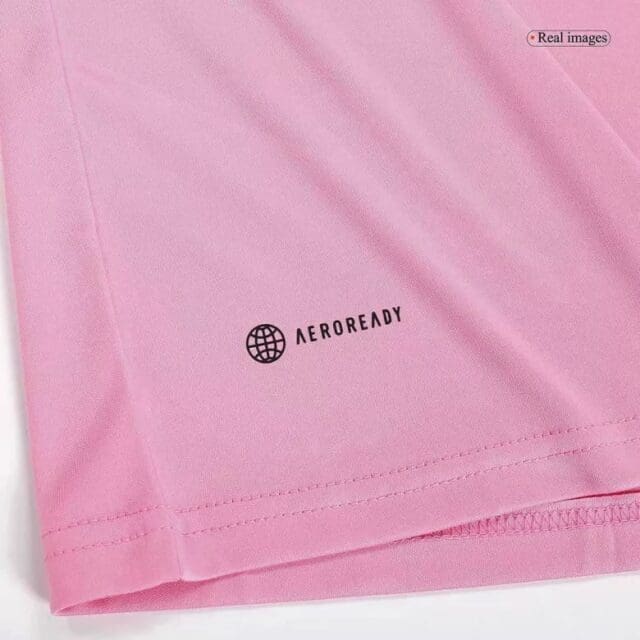 a pink shirt with a logo on it