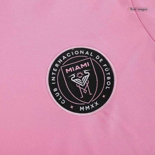 a pink shirt with a logo