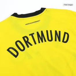 a yellow jersey with black text on it