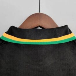 a black shirt with yellow and green stripes