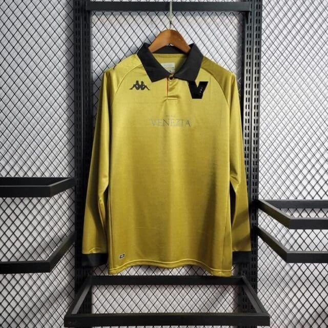 a yellow shirt on a rack