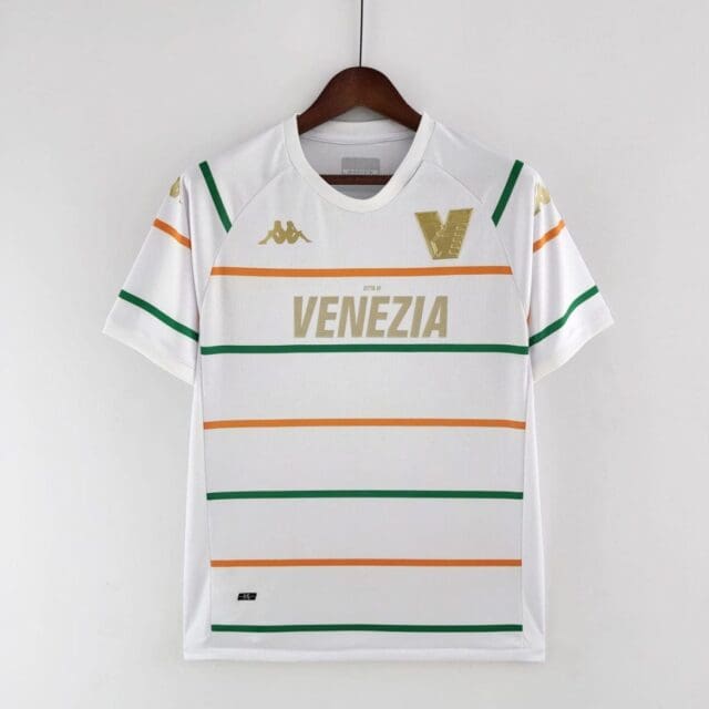 a white shirt with green and orange stripes on a swinger