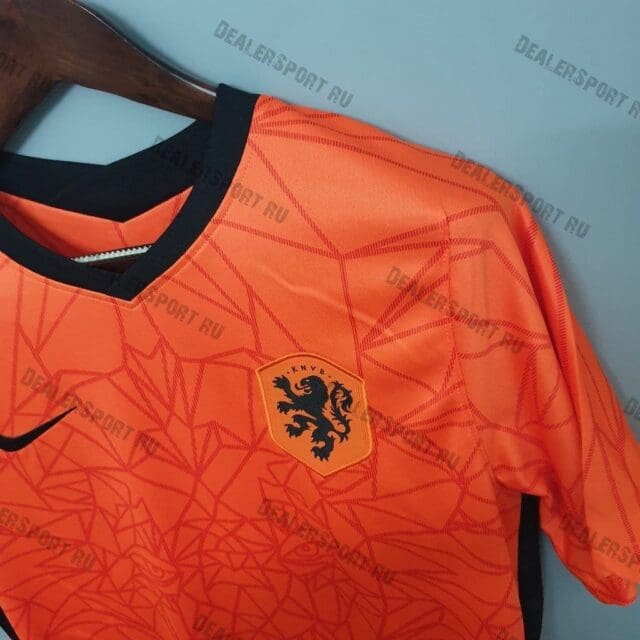 a orange shirt with a lion on it