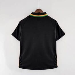 a black shirt with yellow stripes on a swinger
