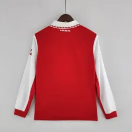a red and white jacket on a swinger