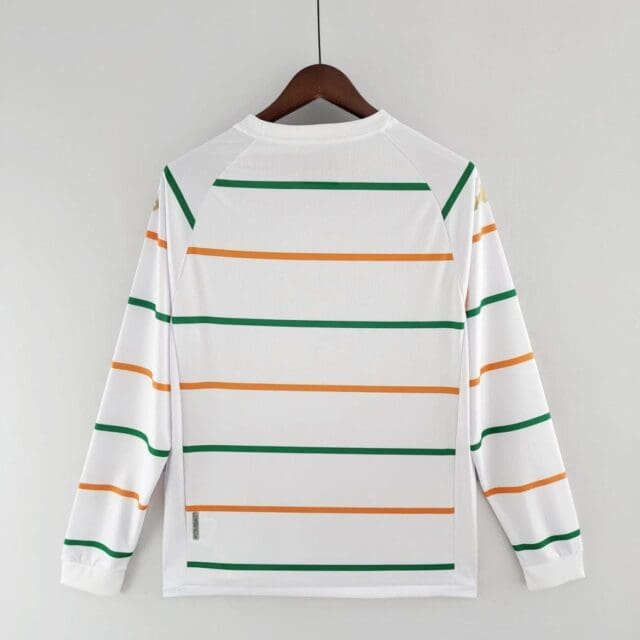 a white shirt with orange and green stripes on a swinger