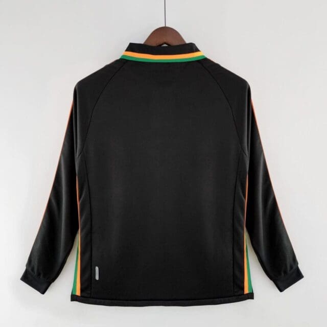 a black jacket with orange and green stripes on a swinger
