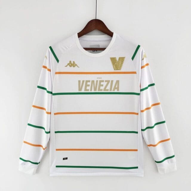 a white shirt with orange green and yellow stripes on a swinger
