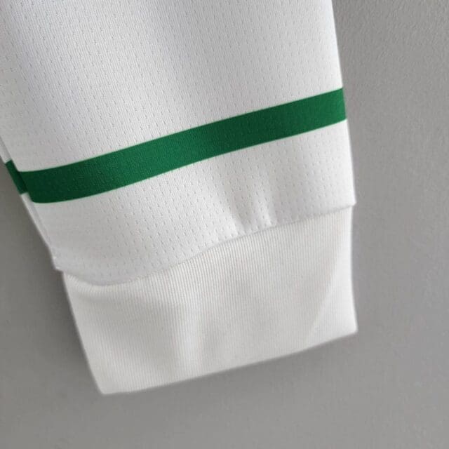 a close up of a white shirt with a green stripe