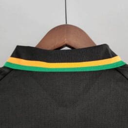 a black shirt with yellow and green stripes