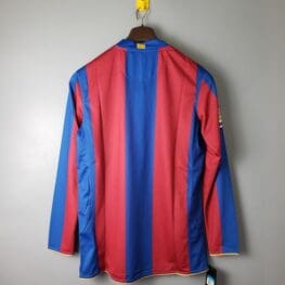 a red and blue striped shirt on a hook