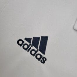 a white shirt with black logo