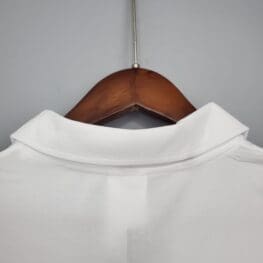 a white shirt on a swinger