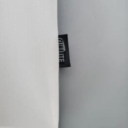 a white fabric with a black label