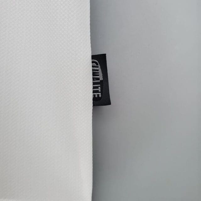 a white fabric with a black label