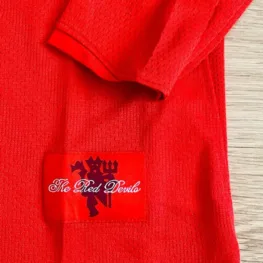 a red shirt with a red label