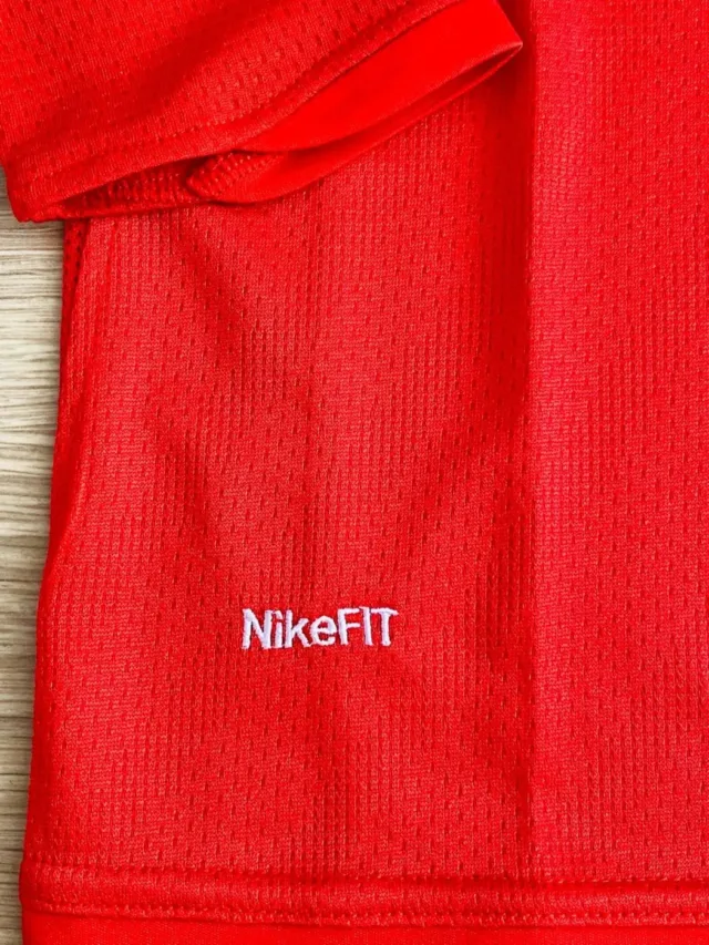 a red fabric with white text on it