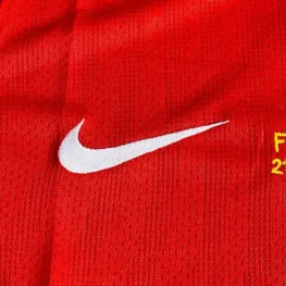 a red jersey with a white swoosh