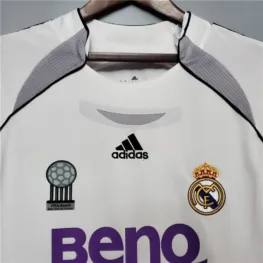 a white shirt with purple letters on it