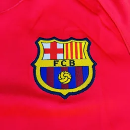 a red shirt with a logo